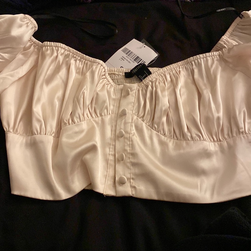 Cream colored satin blouse